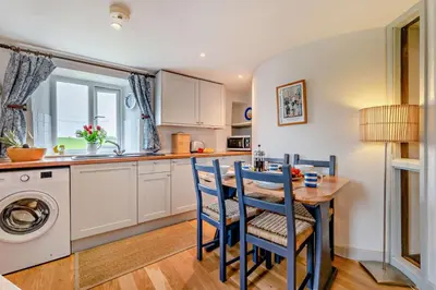 a kitchen with a table and chairs and a sink at 2 Bed in St. Issey oc-t29235 in Saint Issey