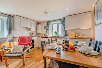 a kitchen and dining room with a table and chairs at 2 Bed in St. Issey oc-t29235 in Saint Issey
