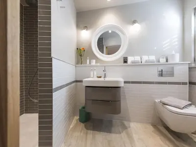 a bathroom with a sink and a toilet and a mirror at Holiday Home Wella by Interhome in St Ives
