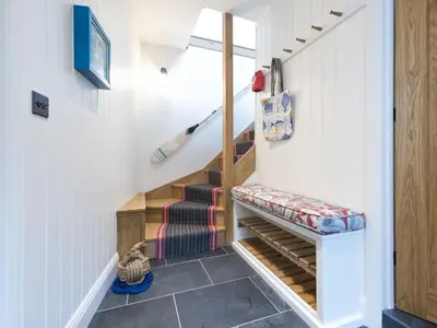 a hallway with a spiral staircase in a house at Holiday Home Iris by Interhome in St Ives