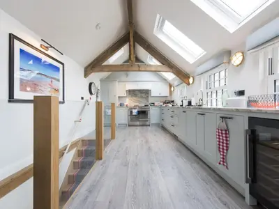 a kitchen with a vaulted ceiling with skylights at Holiday Home Iris by Interhome in St Ives