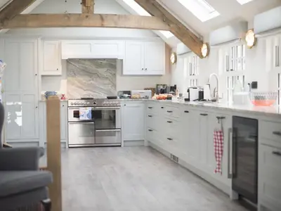 a kitchen with white cabinets and an oven at Holiday Home Iris by Interhome in St Ives
