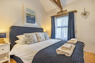 a bedroom with a bed with towels on it at 3 Bed in Padstow oc-h28928 in Padstow