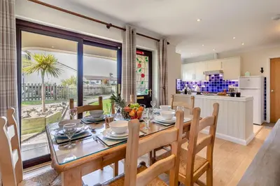 a kitchen and dining room with a table and chairs at 2 Bed in St. Merryn oc-l29063 in St Merryn