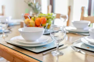 a table with a bowl and a glass on it at 2 Bed in St. Merryn oc-l29063 in St Merryn