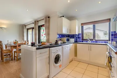 a kitchen with a washer and dryer in it at 2 Bed in St. Merryn oc-l29063 in St Merryn