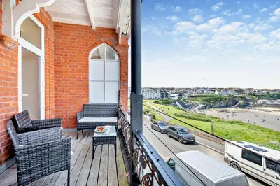 a balcony with chairs and a view of a street at 4 Bed in Newquay oc-w29346 in Newquay