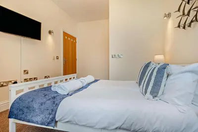 a bedroom with a bed with two pillows on it at 4 Bed in Newquay oc-w29346 in Newquay