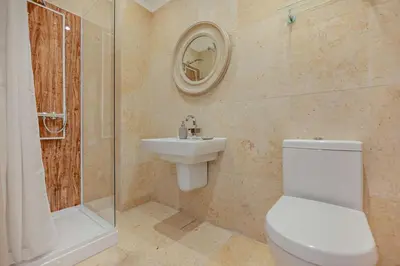 a bathroom with a toilet and a sink and a shower at 4 Bed in Newquay oc-w29346 in Newquay
