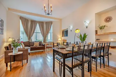 a living room with a table and chairs at 4 Bed in Newquay oc-w29346 in Newquay