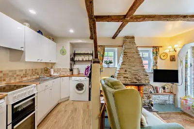 a kitchen with white cabinets and a stove at 1 Bed in Duloe oc-b29367 in Duloe