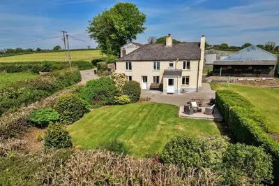 an aerial view of a house with a yard at Finest Retreats - Cutkieve Farm Cottage in Middlehill