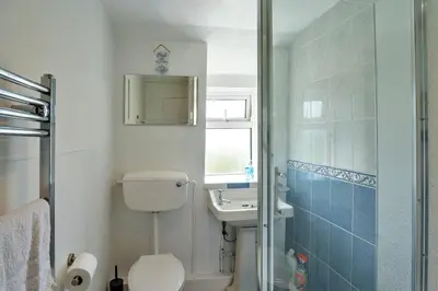 a bathroom with a toilet and a sink at Finest Retreats - Cutkieve Farm Cottage in Middlehill