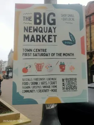 a sign for the big newbury market on a street at 16 Lakeview, Pelham Retreat in Crantock