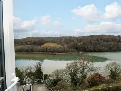 a view of a lake from a balcony at Anjoma in Looe