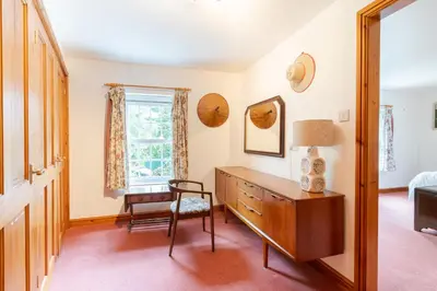 a bedroom with a desk and a chair and a window at Lolgorien, West Cornwall, Sleeps 8 in Camborne
