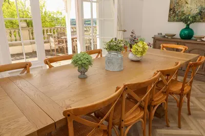 a wooden table with plants on it in a room at Hindon Hall in St Ives