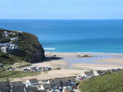 a view of a beach with houses and the ocean at Carew House Cottage in Redruth