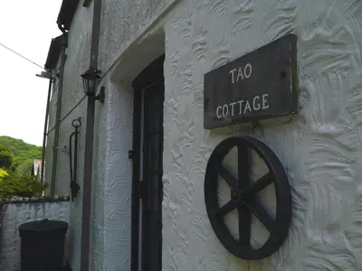 a no coffee sign on the side of a building at Cosy holiday cottage in Boscastle in Boscastle