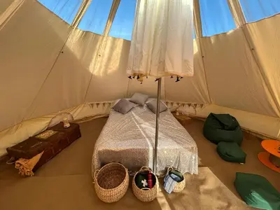 a bedroom with a bed in a tent at Luxury Glamping - Heydaze in Lostwithiel