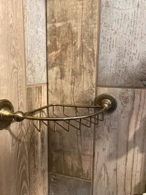 a bronze door handle on a wooden door at The Goose Nest luxury lakeside shepherd hut in Cardinham Woods, Cornwall in Cardinham