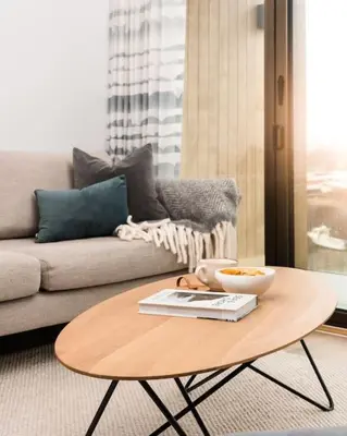 a coffee table in a living room with a couch at Luxury Waterfront 3 Bedroom/3 Bathroom Townhouse in Hayle