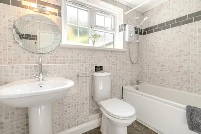 a bathroom with a sink toilet and a mirror at 3 Bed in Cambrose oc-h29392 in Camborne