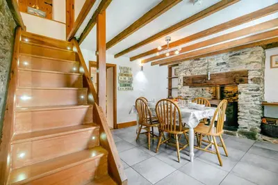 a dining room with a table and chairs at 3 Bed in Cambrose oc-h29392 in Camborne