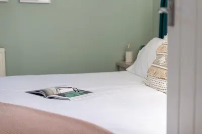 a book sitting on top of a bed at 3 Bed in Mawgan Porth oc-s29403 in Mawgan Porth