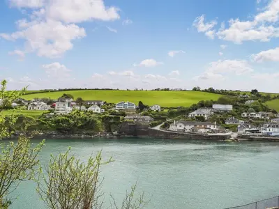 a view of a town and a river with houses at Mermaid Cottage - Uk47403 in Portmellon
