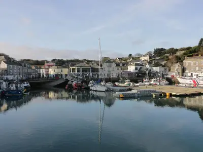 a body of water with boats in a harbor at The Willows in Saint Columb Major