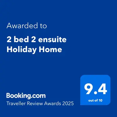 a screenshot of a phone with the text awarded to bed insulated holiday home at 2 bed 2 ensuite Holiday Home in St Austell