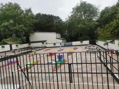 an empty playground in a parking lot at Hayle holiday cottage in Hayle