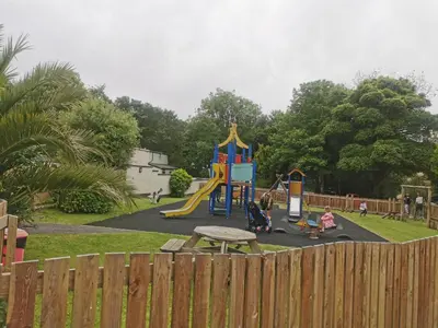 a park with a playground with a picnic table at Hayle holiday cottage in Hayle