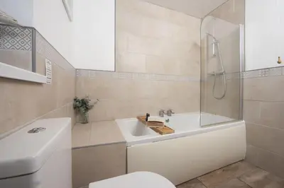 a bathroom with a sink and a shower and a toilet at Wheal Francis - Hot Tub - Accessible Bungalow - Free Wi-Fi - Parking in Helston