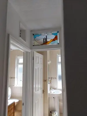 a bathroom with a sink and a toilet and a window at Porthmeor Beach 150 m Parking 2-3 cars in St Ives