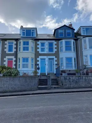a large house with blue doors on a street at Porthmeor Beach 150 m Parking 2-3 cars in St Ives