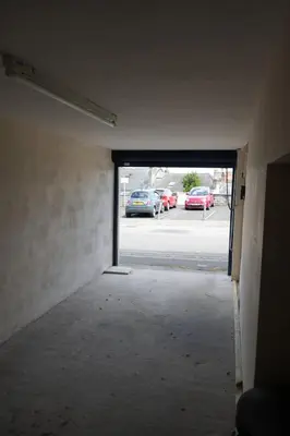 an empty room with a door to a parking lot at Fabulous High Street Townhouse With Stunning Views & Parking at 'Eagles Nest' in Falmouth