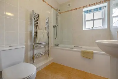 a bathroom with a toilet and a sink and a tub at 2 Bed in Ponsanooth oc-f28845 in Ponsanooth