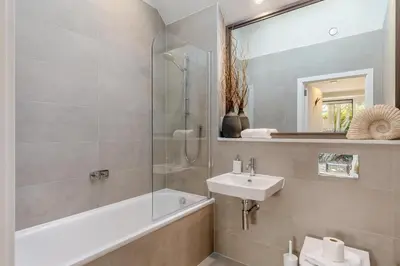 a bathroom with a sink and a tub and a shower at 2 Bed in Padstow oc-t29016 in Padstow
