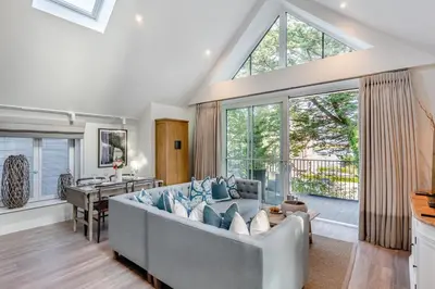 a living room with a couch and a table at 2 Bed in Padstow oc-t29016 in Padstow