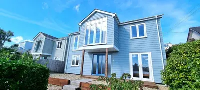 a house with blue siding at Penaflor in Perranporth