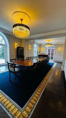 a large dining room with a large table and chairs at Moorswater Lodge Country House with Wine Bar in Liskeard