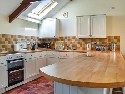 a kitchen with a wooden counter top in a room at Skiber Spar in Davidstow