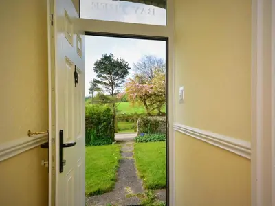 an open door with a view of a garden outside at 4 Bed in St. Austell oc-82414 in Saint Stephen