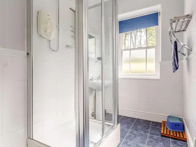 a shower with a glass door in a bathroom at 4 Bed in St. Austell oc-82414 in Saint Stephen