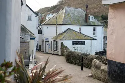 a small street in a town with white buildings at Rosemary Cottage, Port Isaac Bay Holidays in Port Isaac
