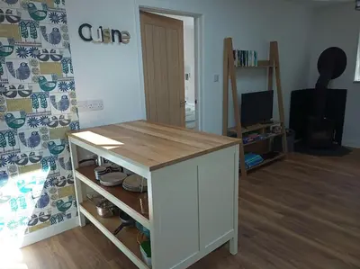 a room with a table with a wooden counter top at Hygga in Fowey
