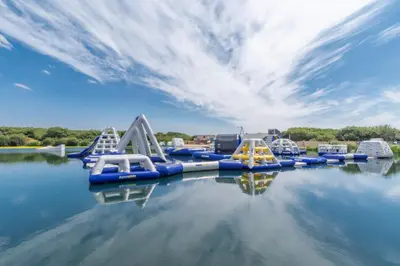 a group of slides in a water park at The Glades - Retallack in Saint Columb Major