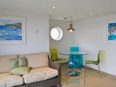 a living room with a couch and a table at Sea Vista in Port Isaac